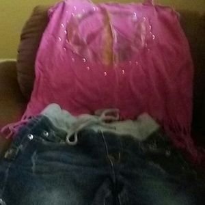 Pink peace sign shirt and denim shorts